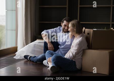 Joyful happy young couple taking break at paper boxes Stock Photo