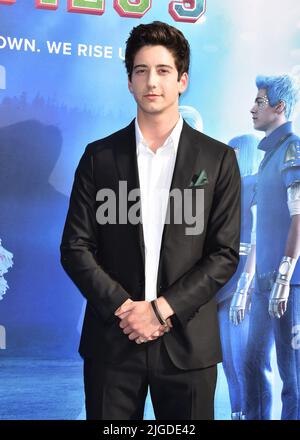 Milo Manheim walking on the red carpet at the Disney+ "Zombies 3" Los