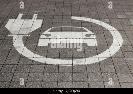 Parking lots for electric cars only. Charging stations stand in a row. Electric car sign. Stock Photo