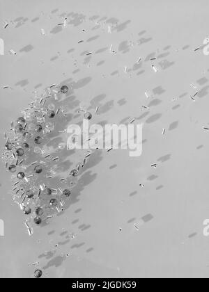 A bunch of crystals and beads spread over the table. Close-up photo. Shadows on the surface. Stock Photo