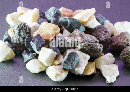 Granites are coarsely crystalline plutonic rocks rich in quartz and feldspar, but also contain dark minerals, Stock Photo