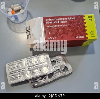 box of hydroxychloroquine sulfate tablets used in certain areas as a treatment for covid Stock Photo