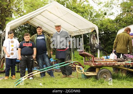 A family of travellers selling harnesses at Appleby Horse Fair, Appleby in Westmorland, Cumbria Stock Photo