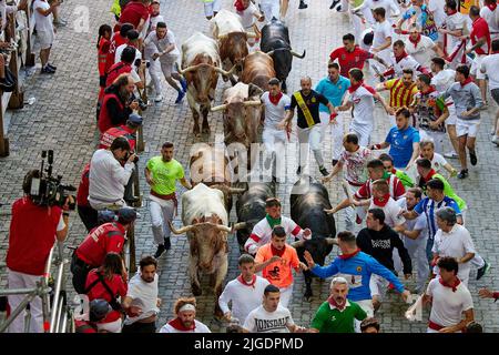 Fourth running of the bulls at the San Fermin Festival in Pamplona, northern Spain, on July 10, 2022. Revelers from all over the world flock to Pamplona every year to participate in the eight days of bullfighting. Made famous by American writer Ernest Hemmingway's 1926 novel 'The Sun Also Rises', the annual San Fermin Festival involves the daily running of the bulls through the historic heart of Pamplona to the bullring (Photo by Ruben Albarran / Pressinphoto / Icon Sport) Stock Photo
