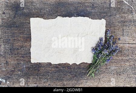 Crumpled parchment for baking and on a wooden background. Copy space for text or design.Top view. Stock Photo