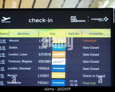 Flight information board at Faro airport Stock Photo