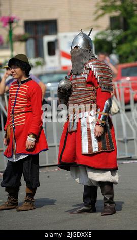 Reenactors dressed in armor of an Old Russian footmen standing on a street before fight reconstruction. July 7, 2019. Kyiv, Ukraine Stock Photo