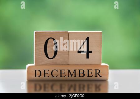 December 4 text on wooden blocks with blurred nature background. Copy space and calendar concept Stock Photo