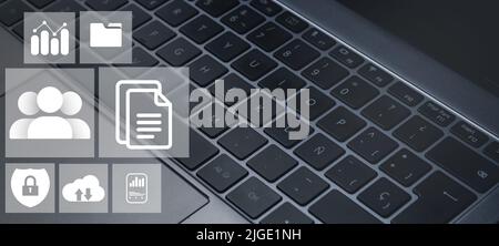 Banner close up of laptop keyboard with digital administration interface. Document Management System Concept. Corporate business technology. Stock Photo