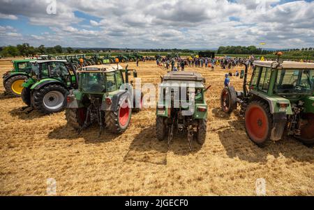 Stuttgart, Germany. 10th July, 2022. During a demonstration of Filderland farmers against the construction of the railroad tunnel 'Pfaffensteigtunnel', tractors stand on a field in Stuttgart-Plieningen. During the demonstration, the farmers have, among other things, surrounded with their tractors an area that would be taken away from them by the construction site of the planned Pfaffensteig tunnel. Credit: Christoph Schmidt/dpa/Alamy Live News Stock Photo