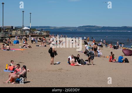 Edinburgh, UK. 10th July, 2022. On what is likely to turn out to be the hottest day of the year so far thousands of people flock to Portobello beach to enjoy the sand, sea and sunshine. &copy; Credit: Cameron Cormack/Alamy Live News Stock Photo