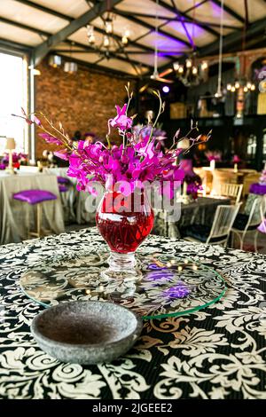 A vertical shot of s purple-themed decor in the venue for a party event Stock Photo