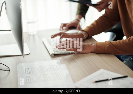 Hands of developer writing and debugging code on computer in office Stock Photo