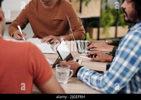 Cropped image of software development team having weekly round table discussion Stock Photo