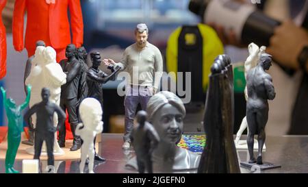 Exposition of 3d printed figures of people. Beautiful three-dimensional models. Stock Photo