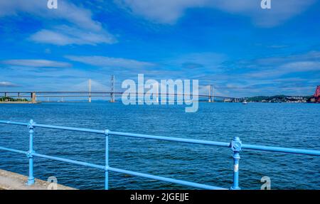 Forth Road Bridge and the Queensferry Crossy (in the background) from South Queensferry Stock Photo