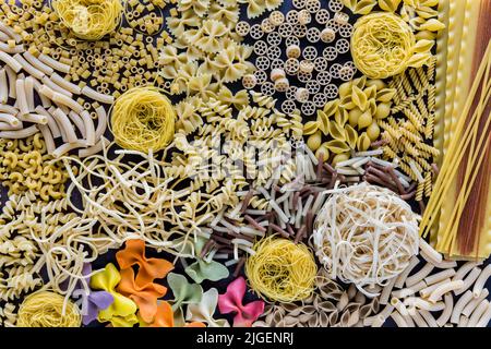 Dry pasta scattered about in an abstract design. Stock Photo