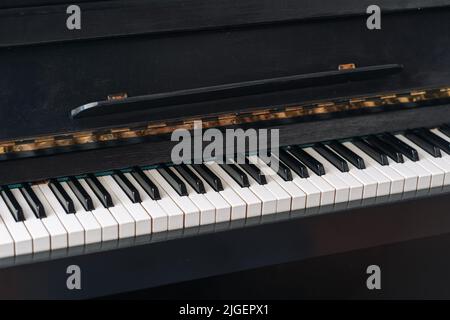 The old black piano. close-up of keys. Stock Photo
