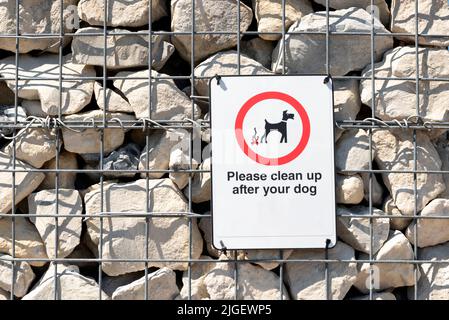 Sign: Please clean up after your dog Stock Photo