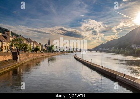 beautiful view of Heidelberg an Neckar River in summer evening light. Heidelberg in Germany is known for its university and romantic flair Stock Photo