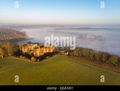 Morning mist rising over the River Wye next to Goodrich Castle. Stock Photo