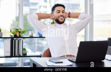 Taking pride in my accomplishments. a young businessman taking a break from work. Stock Photo
