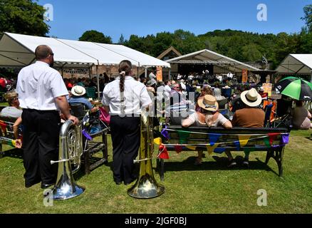 Ironbridge Gorge, Shropshire, Uk.July 10th 2022. Ironbridge Gorge Brass Band Festival 2022. Spectators and musicians enjoying glorious summer weather and a free mucic festival in the grounds of the museum of iron. Credit: Dave Bagnall /Alamy Live News