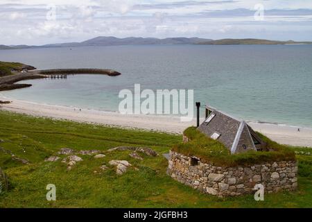 Breakwater, Eriskay Ferry Terminal at Ceann a' Ghàraidh with Barra in the background Stock Photo