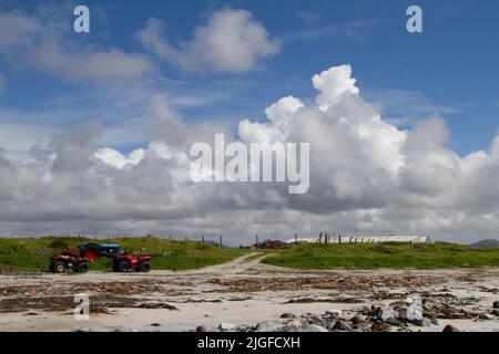 Farm vehicles on Boisdale Beach, South Uist, Outer Hebrides Stock Photo