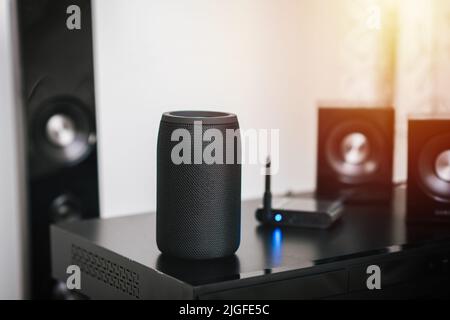 Black mini wireless portable bluetooth speaker for music listening. Stock Photo