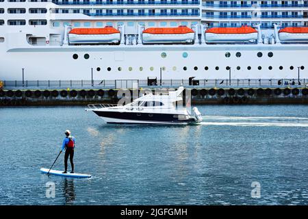 Alesund, Norway - July 2018. Transportation  ferry cruise passenger and people canoeing in Norway , Alesund, Norway. Stock Photo