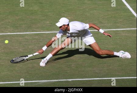 London, UK. 10th July, 2022. Serbian Novak Djokovic lunges for the ball in the Men's Final match against Australian Nick Kyrgios on day fourteen of the 2022 Wimbledon championships in London on Sunday, July 10, 2022. Djokovic won the match 4-6, 6-3, 6-4, 7-6. Photo by Hugo Philpott/UPI Credit: UPI/Alamy Live News Stock Photo