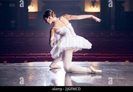 Every dance is a chance for improvement. a ballerina performing her routine. Stock Photo
