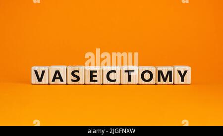 Vasectomy symbol. Concept words Vasectomy on wooden blocks. Beautiful orange table orange background. Medical and vasectomy problem concept. Conceptua Stock Photo