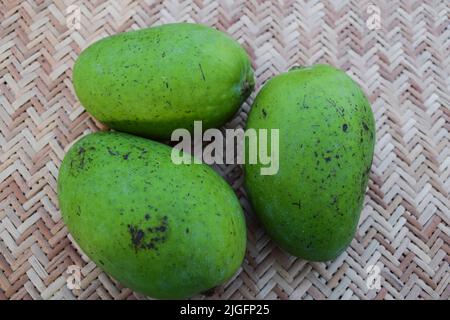 Top view of Green raw Mango fruit. Fresh organic indian fruits Stock Photo