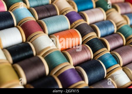 Multi-colored spools of thread close-up Stock Photo