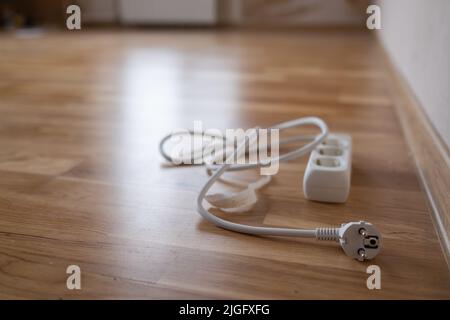 white multi plug electrical power strip with long cable for extend the power supply cord Stock Photo