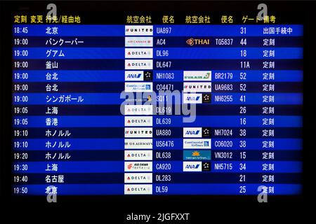 Flight  departure board Narita International Airport Japan Stock Photo