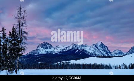 Warm colors of sunrise over the Sawtooth’s of Idaho Stock Photo