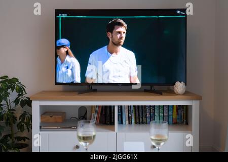 Cameron Norrie during his Wimbledon 2022 men's tennis semi final against Novak Djokovic on 8th July 2022 on a flatscreen tv in a lounge. UK Stock Photo