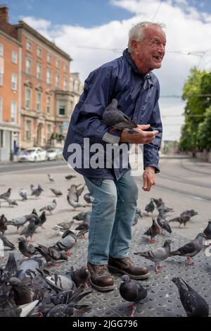 Pigeon Man in Dublin, Ireland Stock Photo