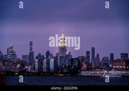 Cityscape of Manhattan from the Hudson river, taken at night on a rainy day Stock Photo