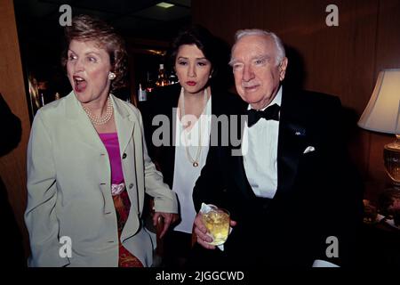 Legendary television news anchor Walter Cronkite, right, with news anchor Connie Chung, center, during the American News Women’s Club annual Roast and Toast Dinner at the Four Seasons Hotel, May 13, 1997 in Washington, D.C. Cronkite was presented with the Excellence in Journalism Award during the event. Stock Photo