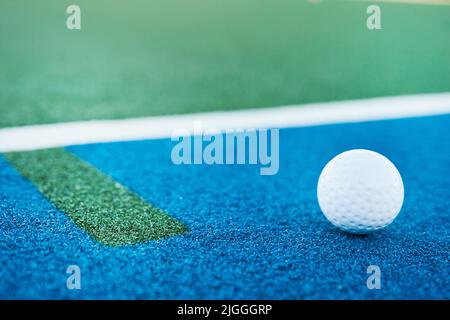 Dont just set goals, score them. Closeup shot of a hockey ball on a pitch. Stock Photo