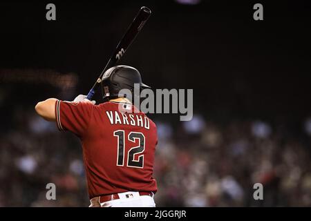 Arizona Diamondbacks catcher Daulton Varsho (12) makes a leaping catch at  the outfield wall in the fifth inning against the Los Angeles Dodgers  during a MLB baseball game, Monday, Sept. 1, 2020