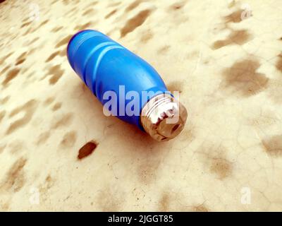 blue water bottle on bet road Stock Photo