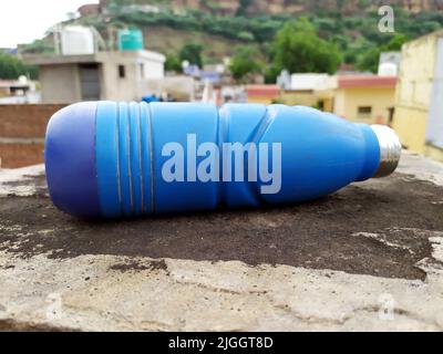 blue water bottle on bet road Stock Photo