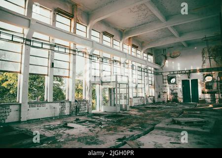 Abandoned ruined industrial building room inside interior, dark dirty grunge and creepy atmosphere Stock Photo