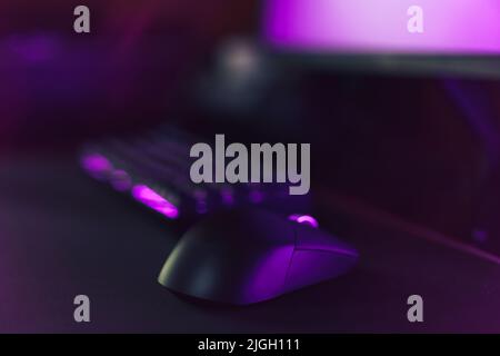 Gaming accessories on neon purple background Stock Photo