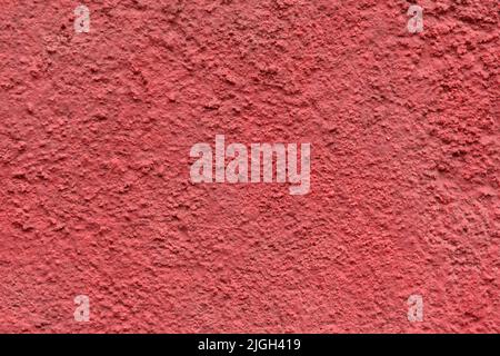 a concrete wall painted with red spray paint Stock Photo